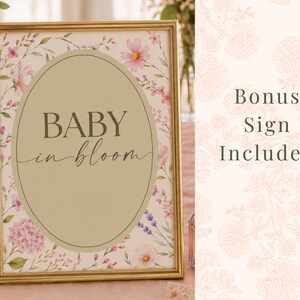 Bonus Baby in Bloom printable sign included with floral baby shower decor set. Elegant blush pink botanical baby shower sign displayed in gold frame, perfect for Baby in Bloom baby shower table decor, printable party signage, and matching floral baby shower decorations. Instant digital download bonus printable for a girl baby shower.