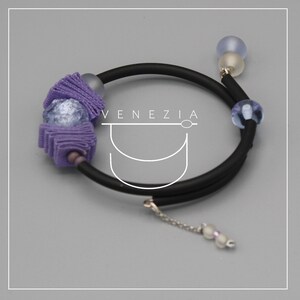 May include: A set of three ceramic mugs with a speckled, matte finish. The mugs are in shades of cream, light gray, and dark gray. Each mug has a simple, minimalist design, perfect for coffee or tea.