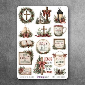 Op de afbeelding: Een stickervel met religieuze kerstafbeeldingen, waaronder een krans met een kruis, een kerk, een lantaarn, kaarsen, een open boek en teksten zoals Jesus is the light of the world, Keep Christ in Christmas en Joy to the World.
