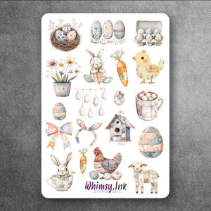 May include: A sticker sheet featuring watercolor illustrations of Easter-themed items including decorated eggs, a nest, a bunny, a carrot, a chick, a mug, a birdhouse, a bow, a headband, a hen, and a lamb. The text Whimsy.Ink is printed at the bottom.