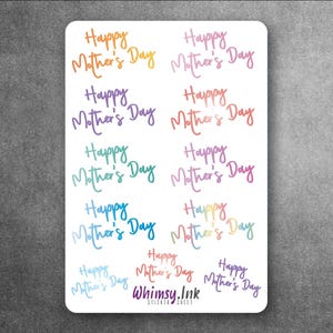 May include: A white rectangular sticker sheet featuring eleven individual stickers with the text Happy Mother's Day in various colors and gradients. The text is written in a cursive script font. The brand name Whimsy.Ink is printed at the bottom.