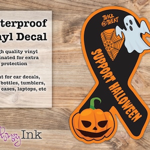 May include: A ribbon-shaped vinyl decal featuring a black background with an orange border. It displays a white ghost, an orange spiderweb, a jack-o'-lantern, and the text "TRICK OR TREAT" and "SUPPORT HALLOWEEN" in orange lettering.