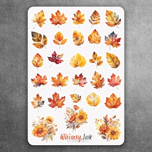 May include: A rectangular sticker sheet featuring a collection of watercolor-style autumn leaves in shades of orange, yellow, red, and brown. At the bottom, there are three floral arrangements and the text Whimsy.Ink STICKER SHEET in orange.