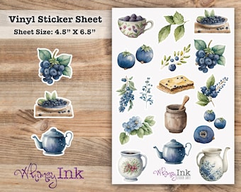 May include: A vinyl sticker sheet measuring 4.5 inches by 6.5 inches featuring watercolor illustrations of blueberries, green leaves, a blueberry tart, a wooden honey pot, a blue teapot, and floral patterned ceramic teacups and pitchers.