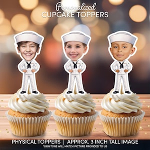 May include: Three personalized cupcake toppers featuring cartoon-style bodies in white sailor uniforms with navy blue neckerchiefs and white hats. Each topper has a realistic photographic face. The text reads Personalized CUPCAKE TOPPERS.