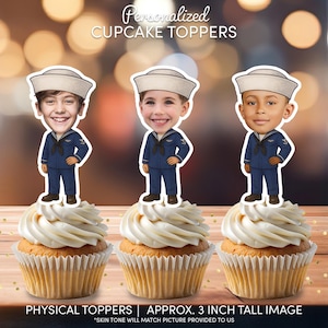 May include: Three personalized cupcake toppers featuring cartoon-style navy sailor uniforms with white hats and dark blue suits. Each topper displays a different smiling face and measures approximately 3 inches tall. The text reads Personalized Cupcake Toppers.