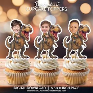 May include: Three cupcakes topped with personalized dinosaur-themed cupcake toppers. Each topper features a child's face riding a Tyrannosaurus Rex. The text "Personalized CUPCAKE TOPPERS" is at the top. The bottom text reads "DIGITAL DOWNLOAD | 8.5 x 11 INCH PAGE".