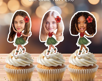 May include: Three cupcakes topped with personalized cartoon cutouts of girls in Hawaiian outfits. The girls have different skin tones and hairstyles, each wearing a red top, green skirt, and a red flower in their hair. The text "Personalized CUPCAKE TOPPERS" is at the top.