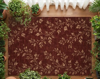 Puede incluir: Una alfombra rectangular de color burdeos con un diseño de hojas y vides beige. La alfombra está rodeada de plantas en macetas y se encuentra sobre un suelo de madera. Cortinas blancas son visibles en el fondo.