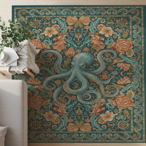 Op de afbeelding: Teal vloerkleed met een centraal ontwerp van een lichtblauwe octopus, omringd door bloemen en nautische motieven. Het kleed heeft een gedetailleerde rand en een vintage stijl, met oranje en teal tinten. Afmetingen zijn ongeveer 200 cm x 150 cm.