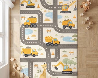 May include: A rectangular children's rug featuring a road and construction vehicle design. The rug has a cream background with gray roads, yellow construction vehicles, and a giraffe. The rug includes a crane, dump trucks, and an excavator.