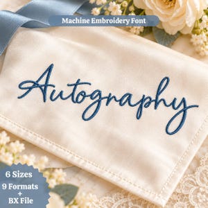 May include: A cream-colored fabric swatch featuring the word Autography embroidered in dark blue thread. The text Machine Embroidery Font is displayed above, while the text 6 Sizes 9 Formats + BX File is visible below.