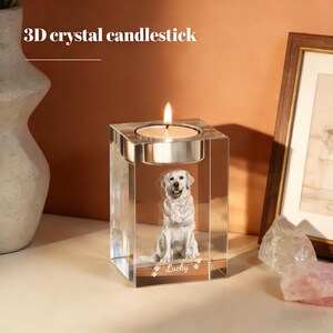 May include: A clear crystal candlestick with a lit candle. The candlestick features a 3D image of a golden retriever dog. The text "3D crystal candlestick" is at the top. The dog's name "Lucky" is at the bottom.