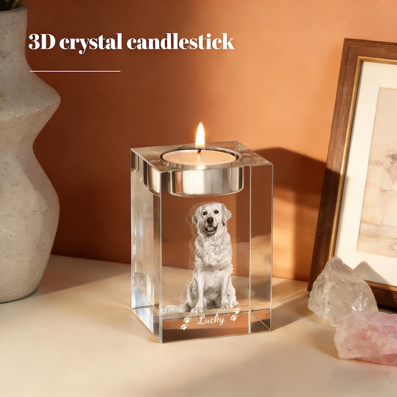 May include: A clear crystal candlestick with a lit candle. The candlestick features a 3D image of a golden retriever dog. The text "3D crystal candlestick" is at the top. The dog's name "Lucky" is at the bottom.