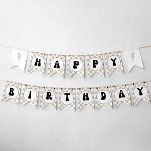 May include: A brown and white checkered banner with black letters that reads "Happy Birthday". The banner has lightning bolt accents on each end.