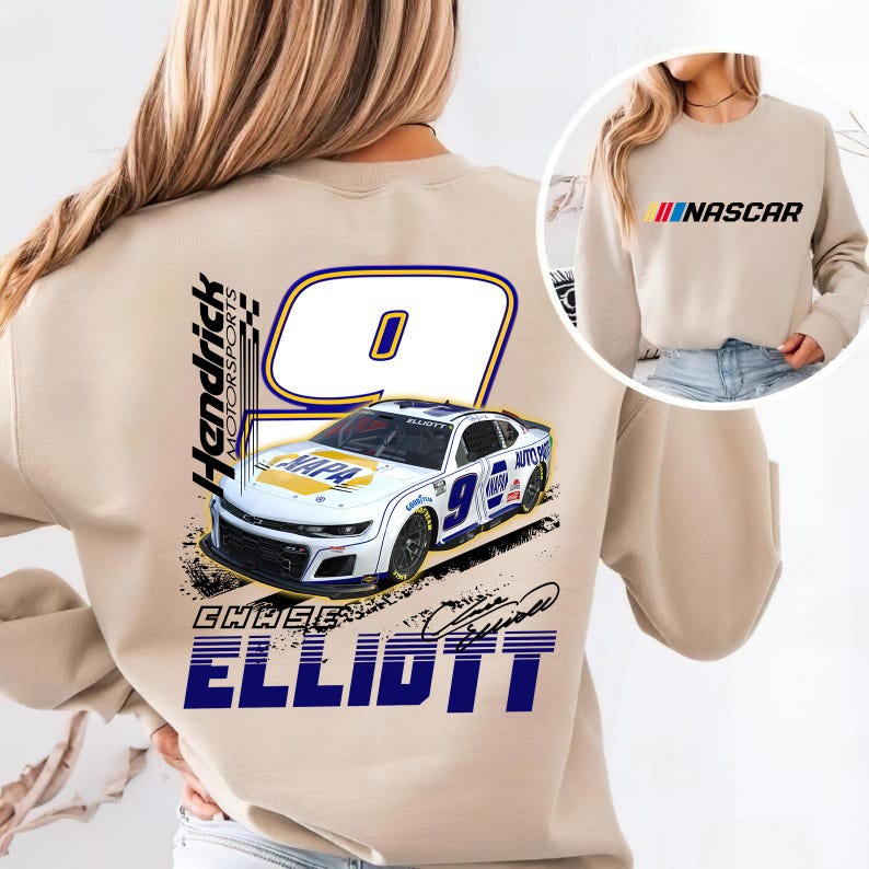 May include: Beige sweatshirt featuring a graphic of a white race car with the number 9 and the name "Chase Elliott." The back of the sweatshirt displays the Hendrick Motorsports logo and the word "ELLIOTT" in blue. The front has the word "NASCAR" in red, yellow, and blue.