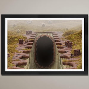 May include: A black and white photograph of a circular doorway in a stone structure. The doorway is surrounded by a series of concentric circles, creating a pattern of steps leading up to the entrance. The photo is taken from a low angle, giving the viewer a sense of perspective.