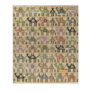 May include: A rectangular rug with a beige background featuring a repeating pattern of stylized camels in various colors including green, blue, orange, and purple, interspersed with human figures and a small rectangular tag labeled Hankwoven.