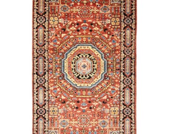 May include: A rectangular, red oriental rug with an intricate geometric pattern. The rug features a central medallion in shades of blue, beige, and black, surrounded by a detailed border. The overall design is symmetrical, with repeating motifs.