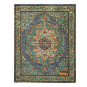 May include: Rectangular area rug with a central medallion design. The rug features a teal and gray color palette with floral and geometric patterns. The border is a darker shade of teal with a brown trim. The rug has the text "HANKWOVEN" on the bottom right.