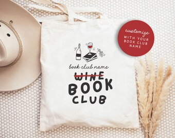 May include: White canvas tote bag with a black and white illustration of a wine bottle, a glass of wine, and a stack of books. The text "book club name" is written above the illustration. The text "wine" is crossed out and the text "book club" is written below the illustration. A red circle with the text "customize with your book club name" is in the upper right corner of the image.