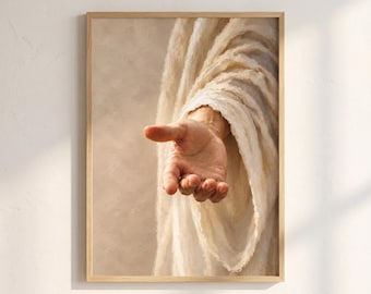 May include: A framed wall art print featuring a close-up of an outstretched hand reaching forward, draped in heavy, textured off-white fabric. The composition focuses on the palm and fingers, with soft, warm lighting creating deep shadows in the folds of the cloth.