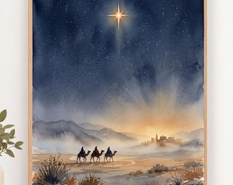 May include: A watercolor painting in a wooden frame depicting three figures riding camels across a desert landscape toward a distant town. A bright, glowing star shines in the dark blue night sky above, casting light over the mountains and sandy terrain.