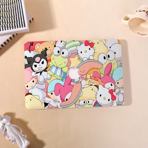 May include: A rectangular laptop hard shell case featuring a colorful, dense collage of various Sanrio characters including Hello Kitty, My Melody, Keroppi, Kuromi, and Pompompurin. The design includes a central cutout for an Apple logo.