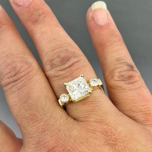 Modern 14kt yellow gold princess cut Moissanite - 2.80 carat total weight.