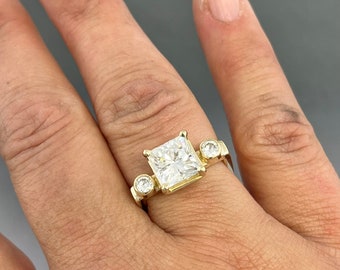 Modern 14kt yellow gold princess cut Moissanite - 2.80 carat total weight.