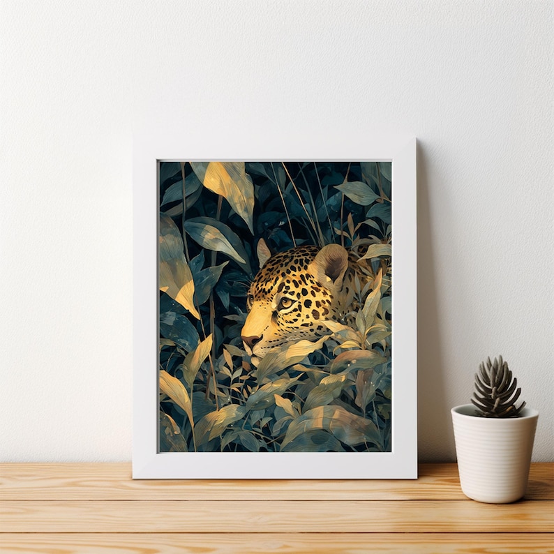 May include: A framed art print featuring a watercolor illustration of a jaguar in a lush, green jungle setting. The jaguar's spotted coat and golden eyes are visible amidst the foliage. The artwork is framed in a white border, creating a striking contrast.