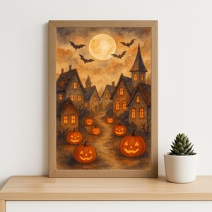 Peut inclure: Peinture à l'aquarelle d'une scène d'Halloween avec une pleine lune, des chauves-souris et un village de maisons aux fenêtres éclairées. Des citrouilles d'Halloween bordent le chemin. L'œuvre est encadrée dans un cadre en bois brun clair.