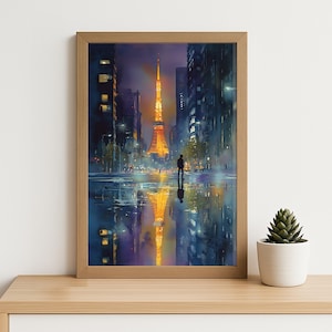 May include: Watercolor painting of Tokyo Tower at night, framed in a light wood. The tower glows orange, reflected in the wet street. A lone figure stands in the foreground, surrounded by city buildings.