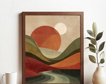 May include: Abstract landscape art print in a brown wooden frame. The artwork depicts a sunset over rolling hills, with a river winding through the scene. The colour palette includes shades of orange, green, and brown.