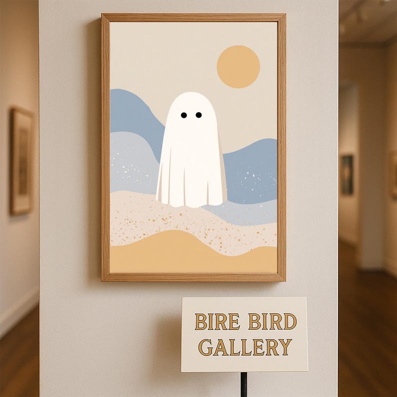 May include: A framed art print with a minimalist ghost illustration. The artwork depicts a white ghost with two black dots for eyes, set against a backdrop of beige, blue, and yellow tones. The frame is made of light brown wood. The sign below reads "BIRE BIRD GALLERY."