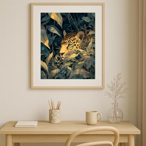 May include: Framed art print featuring a watercolor illustration of a jaguar's head peeking through lush green and yellow foliage. The artwork has a natural, jungle theme, with a light wooden frame.