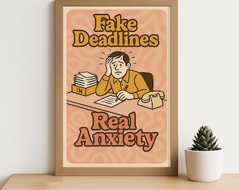 May include: A framed print with the words "Fake Deadlines" and "Real Anxiety" in a retro font. The illustration depicts a person at a desk looking stressed, with a phone and paperwork. The background is a peach color with a swirl pattern.