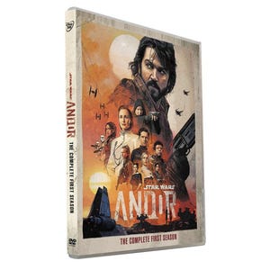 May include: DVD case for Star Wars: Andor, The Complete First Season. The cover features a group of characters with a man in the center. The title "ANDOR" is prominently displayed, with the Star Wars logo above it. The case has a beige background.