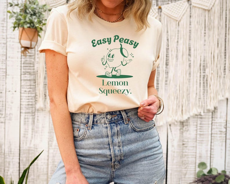 May include: A white t-shirt with a green graphic of a cartoon lemon with the text "Easy Peasy Lemon Squeezy."