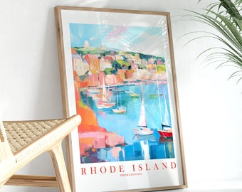 May include: A colorful painting of a harbor scene with sailboats and buildings. The painting is framed in a light wood frame. The text "RHODE ISLAND THE OCEAN STATE" is at the bottom of the painting.