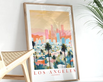 May include: A framed print of a colorful illustration of the Los Angeles skyline with palm trees in the foreground. The text "LOS ANGELES, CALIFORNIA" is at the bottom of the print.