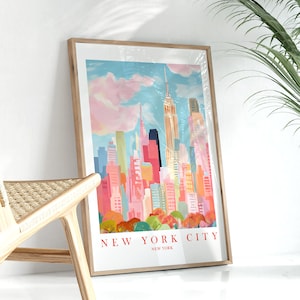 May include: A framed print of a colorful illustration of the New York City skyline with the Empire State Building in the center. The print has the text "NEW YORK CITY" and "NEW YORK" below the illustration.