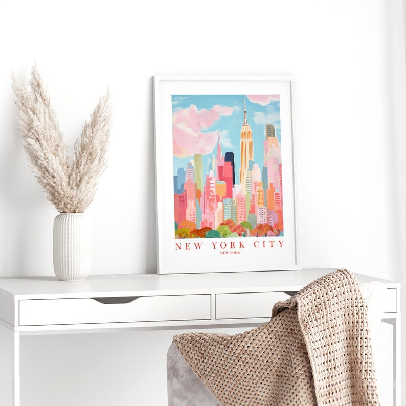 May include: A colorful illustration of the New York City skyline with the Empire State Building in the center. The text "NEW YORK CITY" is printed below the image.