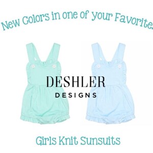 May include: Two knit sunsuits in mint green and light blue. Each has a ruffled trim, button details, and a bubble silhouette. The text "New Colors in one of your Favorites" and "Girls Knit Sunsuits" are displayed. The brand name "Deshler Designs" is also visible.