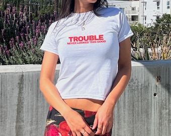 Trouble Never Looked This Good Y2K Baby Tee | Flirty Graphic Festival Crop Top