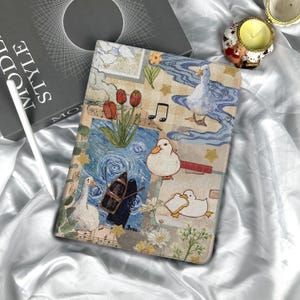 May include: A tablet case featuring a whimsical design with ducks, tulips, musical notes, and a boat against a blue and beige backdrop. The case has a soft, matte finish and is designed to protect the tablet from scratches and damage.