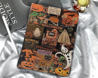 May include: A Halloween-themed tablet case featuring a collage of vintage-style illustrations. The design includes pumpkins, ghosts, and the text "October 31" and "Halloween". The case is rectangular and rests on a white, satin-like surface.