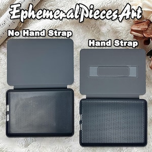 May include: Two gray tablet cases, one with a hand strap and one without. The cases are open, revealing a black interior with a honeycomb pattern. The text "Ephemeral Pieces Art" and "No Hand Strap" and "Hand Strap" are visible.