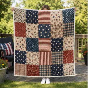 May include: A patchwork quilt featuring a repeating pattern of red, white, and blue squares. The design includes various motifs such as white stars on blue backgrounds, red and white stripes, and floral prints, all bordered by a white trim.