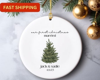 May include: White ceramic Christmas ornament with a green watercolor Christmas tree and the text "our first christmas married Jack & Sadie 4.9.25"